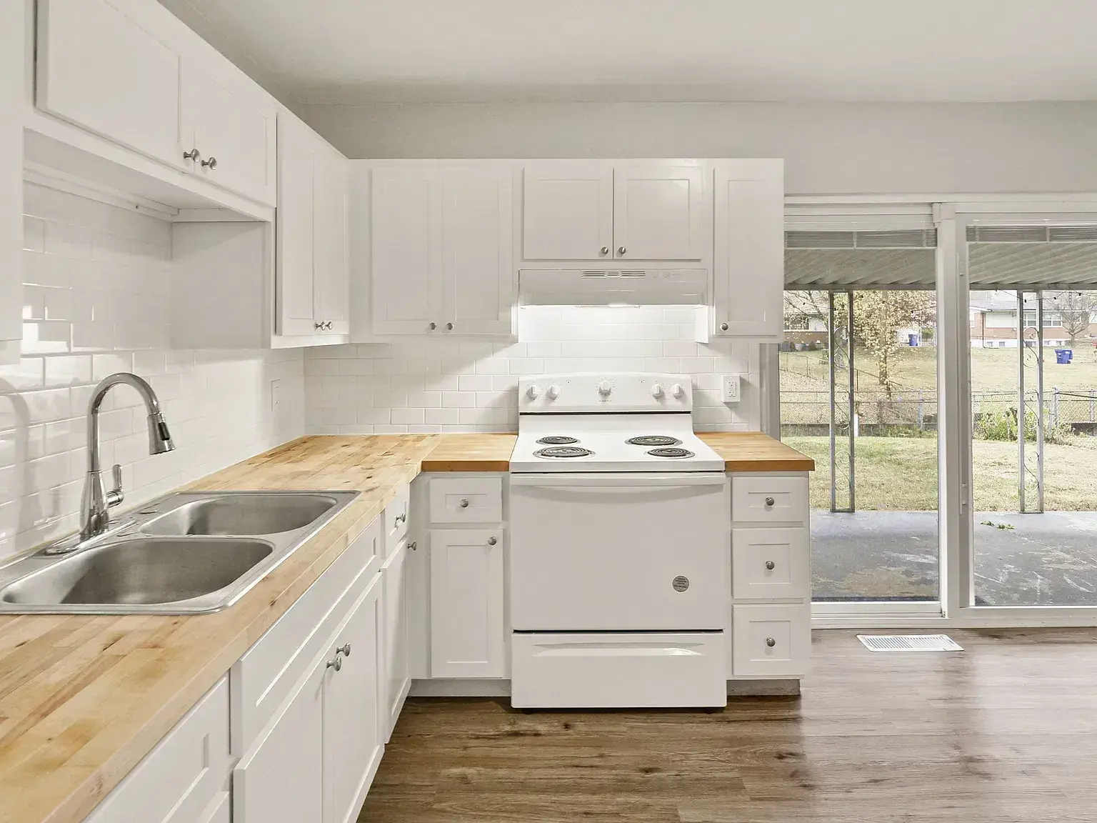 Burning Tree after: new white kitchen with butcher-block counters