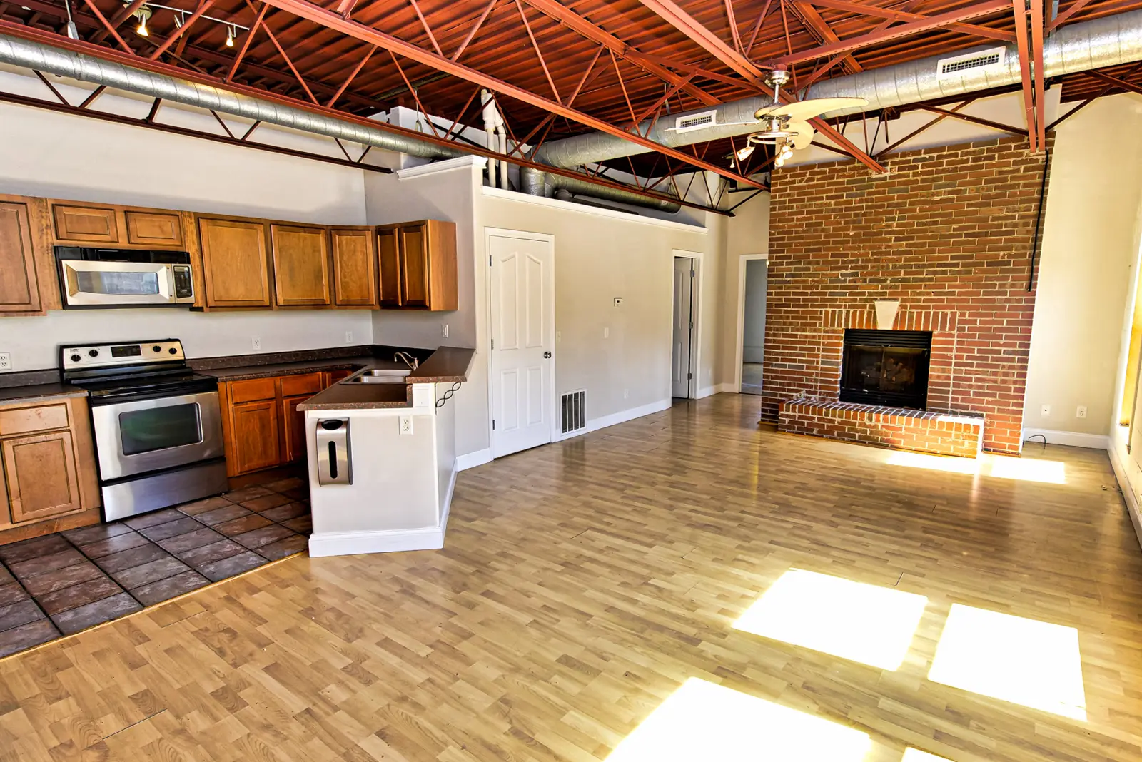 Open living area with brick fireplace