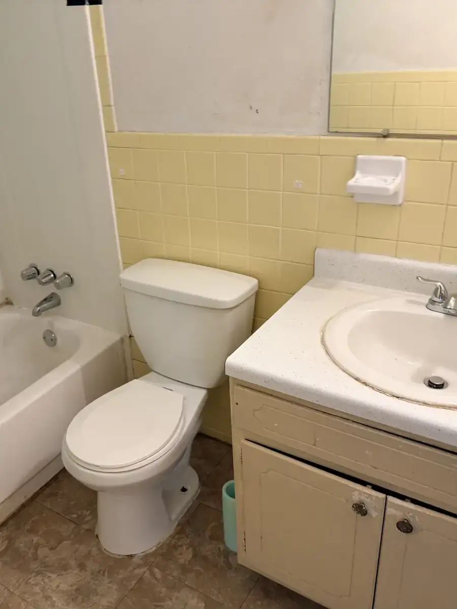 Olian before: dated bathroom